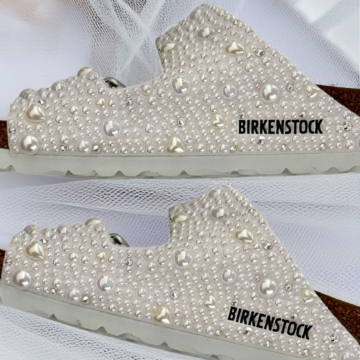 Two side views of Birkenstock Arizona sandals showing straps decorated with pearls, delicate pearl hearts and crystal accents.