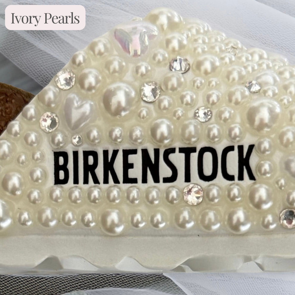 Ivory pearl option on a custom Birkenstock Madrid bridal sandal with delicate heart and crystal accents.