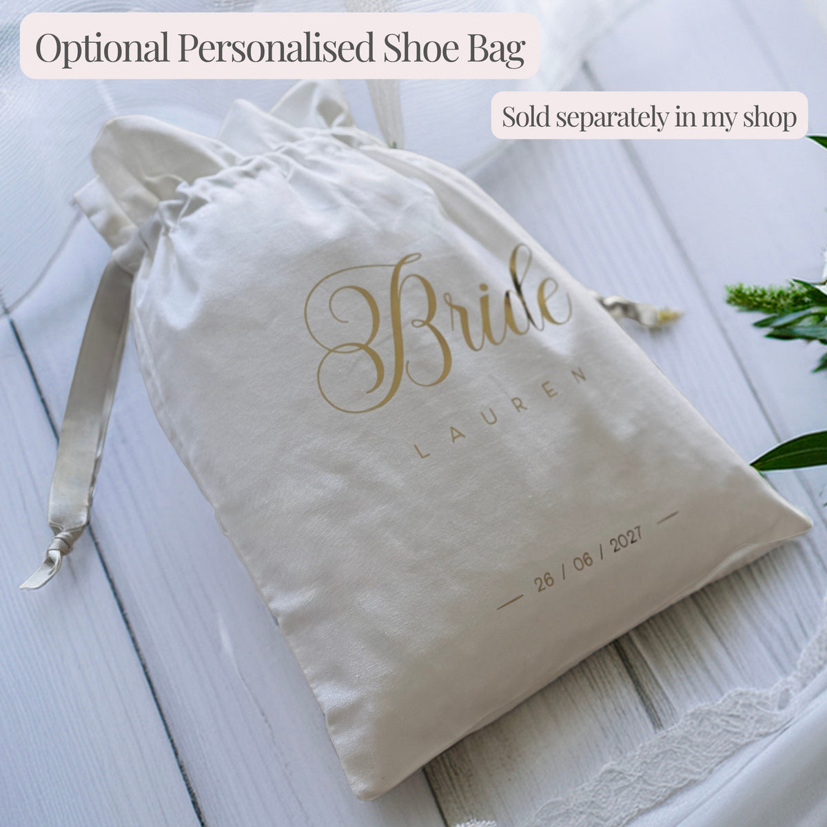 White drawstring shoe bag personalised with “Bride”, plus an example name and wedding date in gold lettering. Sold separately.